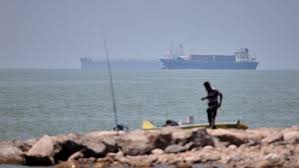 US official: Iranian drone hit vessel, pausing evacuation of ships through Hormuz