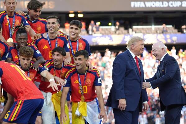 Trump celebrates the World Cup as a US victory as he presents trophy to the winner, Spain