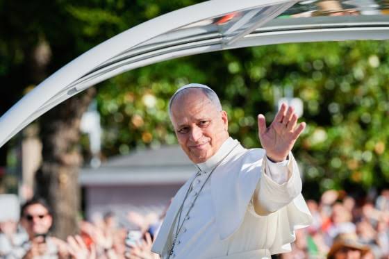 1 million people flood Madrid streets to see the pope’s flower-carpeted procession