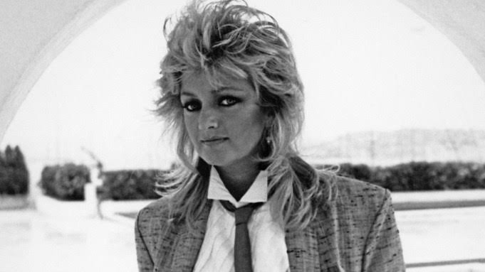 Bonnie Tyler Tributes: Kevin Bacon, Johnny Knoxville & Rod Stewart Remember “One Of The Greatest Voices Of Rock”