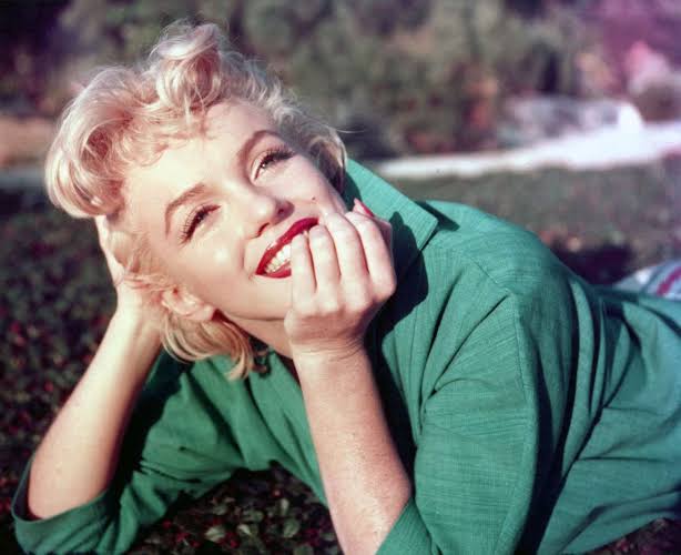 Marilyn Monroe's Playful Side Takes Center Stage in Previously Unseen Photos of Star Getting Her Makeup Done