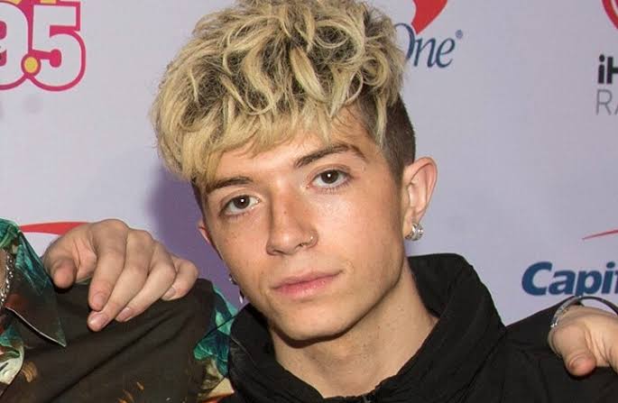Ex-girlfriend of boy band member charged with trying to hire a hitman to kill him
