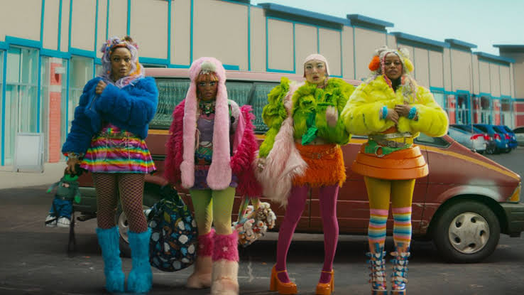 In the neon-drenched world of ‘I Love Boosters,’ fashion is for the people