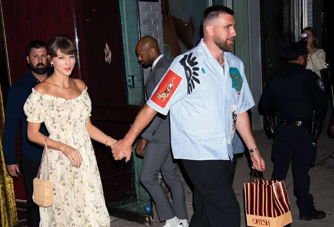 Taylor Swift Debuts New Wedding Ring in a Dreamy Pink Floral Gown With Travis Kelce at Friend’s Wedding