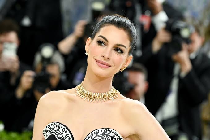 Anne Hathaway Debuts Her Baby Bump in Public as She Sunbathes in a Nearly $700 Bikini