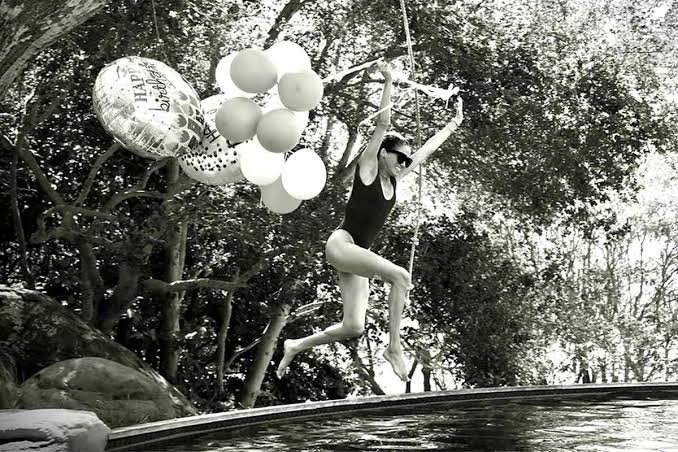 Meghan Markle Makes a Literal Splash in New Photos from 45th Birthday Celebration