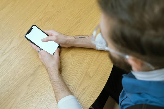 The people who keep their phone face-down on every table aren't being secretive. They learned at some point that being reachable on someone else's schedule was the price of being available, and turning the screen down is the smallest act of sovereignty th