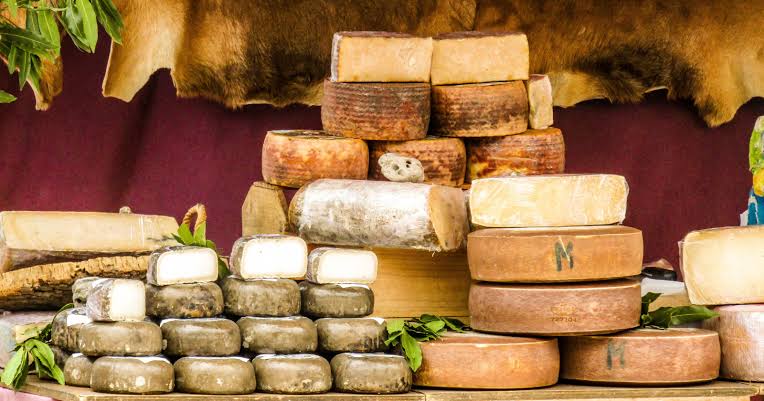 On the island of Sardinia there's a cheese so extreme it's been outlawed across Europe — a pecorino deliberately left open for flies to lay their eggs in, so that by the time it reaches the table it's alive with thousands of tiny maggots, eaten while they're still squir