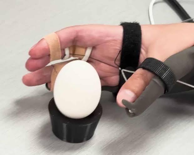 Brain implant helps paralysed man to feed himself and drink from cup