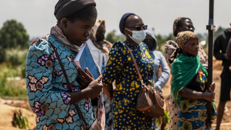 Mourners bury a 6-month-old Ebola victim, marking third orphanage death as Congo outbreak spreads