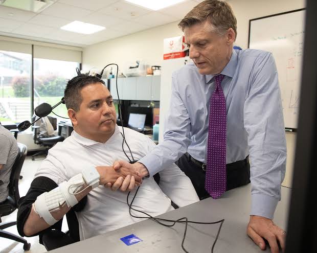 Implant helps paralyzed man to feed himself and drink from a cup