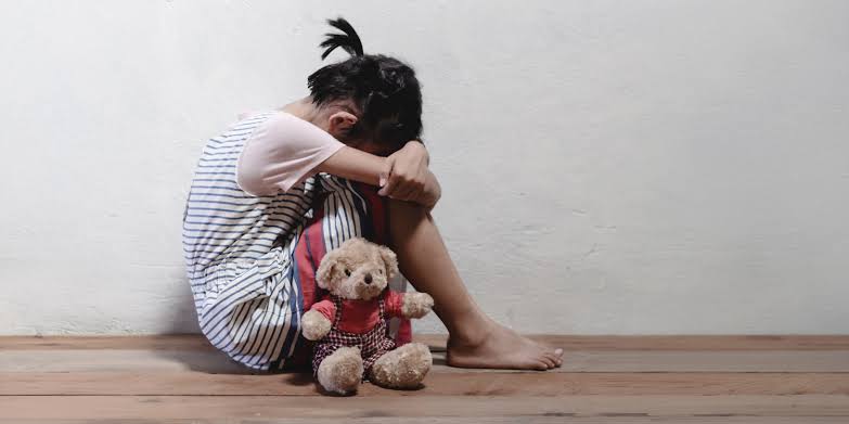 Age at which childhood abuse occurs is associated with distinct brain activity in adulthood