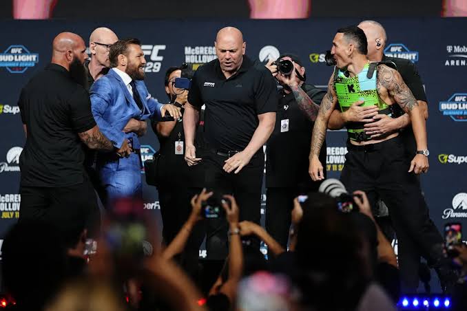 Conor McGregor tosses Max Holloway's sunglasses in heated UFC 329 pre-fight staredown