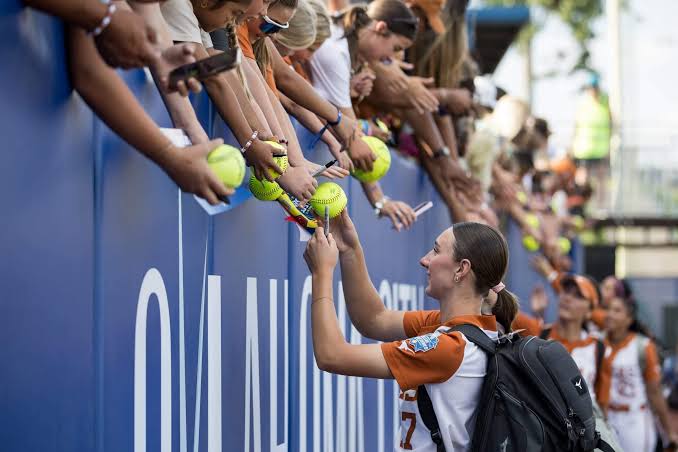 At the Women’s College World Series, there’s no college sports ‘crisis’ in sight