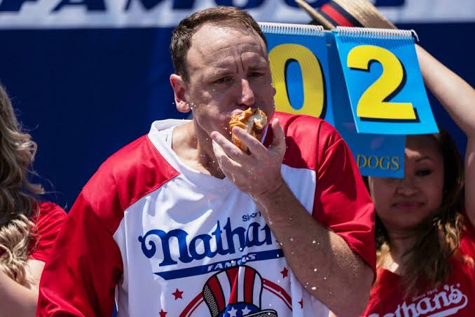 Joey Chestnut to defend hot dog eating title while on probation after pleading guilty to battery