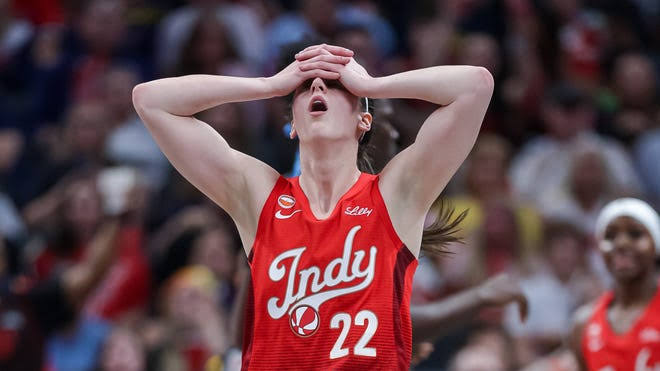 Fever's Caitlin Clark keeps playing after throwing up near bench against Dream