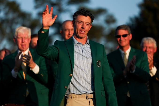 Scottie Scheffler reacts to Rory McIlroy's victory at The Masters as he comes up one stroke short