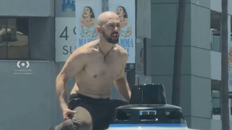 Shirtless man destroys Waymo in busy East Hollywood intersection, video shows; LAPD arrests him for vandalism
