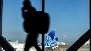 United probing incident after employee's ICE threat caught on video