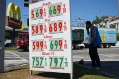 US economy grew a sluggish 0.5% in fourth quarter, government says, downgrading previous estimate
