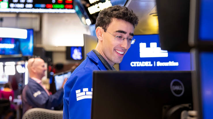 Dow jumps nearly 600 points to record close; Nasdaq slides as chip stocks suffer: Live updates