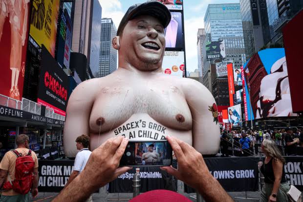 Inflatable Musk Appears in Times Square in SpaceX IPO Protest