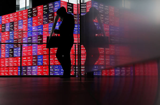 Shares, bonds make guarded gains as oil slips
