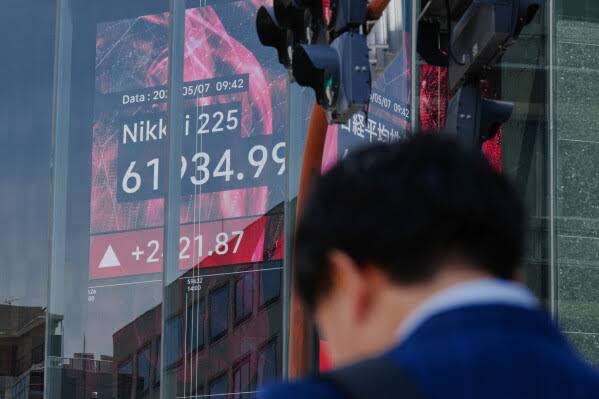 Global shares gain and oil prices fall after Trump says talks on ending the war are proceeding