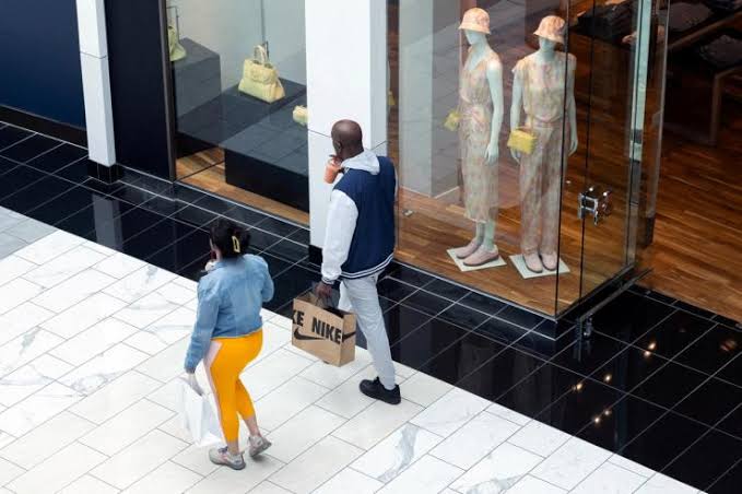 US consumer sentiment falls as Dow hits record
