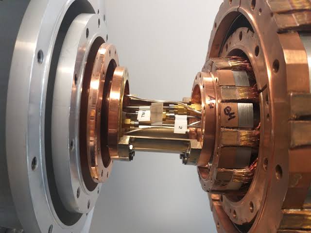 Quantum teleportation carries microwave states at temperatures up to 4 K, beating classical limit