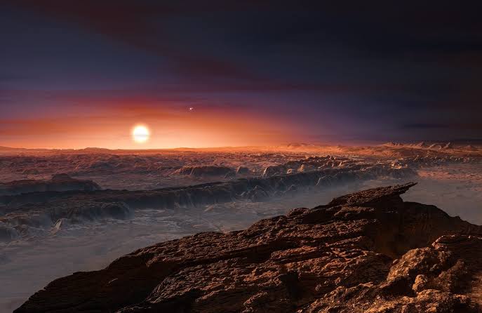 Proxima Centauri b is our closest known habitable-zone exoplanet, just over four light-years away, and it may be warm enough for liquid water if it has kept an atmosphere. But that “if” is enormous: its red-dwarf star blasts it with extreme radiation strong enough