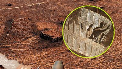 Curiosity Finds "Sea Of Polygons" On Mars. But Photos Of The Rover Itself Show Its Back Wheel Isn't In Great Shape
