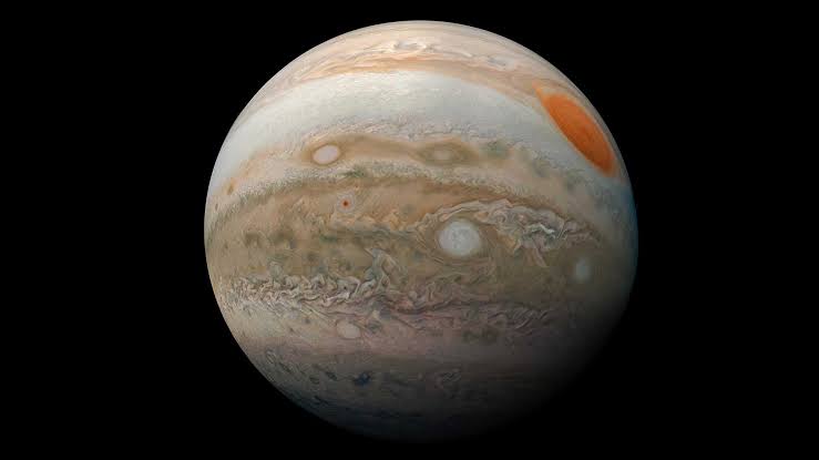 There is no surface anywhere on Jupiter to land on or crash into, just hydrogen that thickens with depth until it stops behaving like a gas and starts conducting electricity like a metal, so a descending probe would be crushed and absorbed into the planet long b