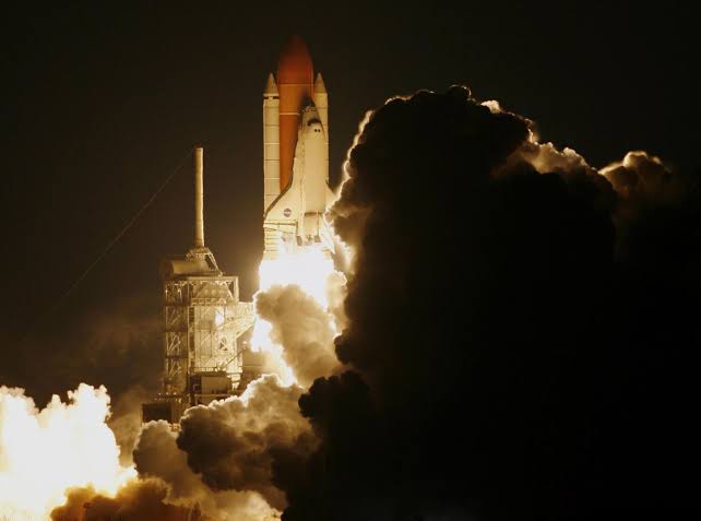 Apollo 12 was struck by lightning twice in the first 52 seconds of flight, filling the spacecraft with warning lights and turning Mission Control’s data into nonsense — until a young controller named John Aaron recognised an obscure failure pattern and calmly sai