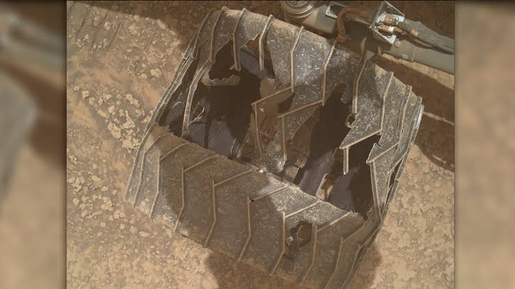 Curiosity Mars rover inspects cracked wheel photo of the day for July 27, 2026