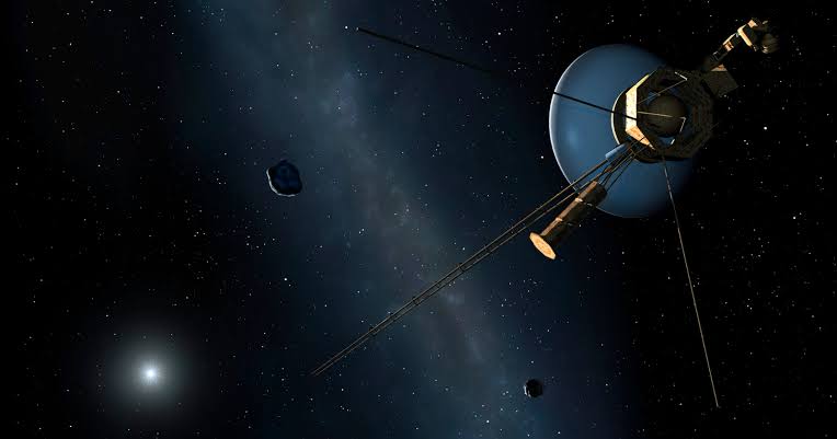 A spacecraft no larger than a small car, launched the year Star Wars came out, is still moving outward at 38,000 miles per hour far beyond the orbit of Pluto — and the radio signals it sends home, traveling at the speed of light, now take more than 23 hours to re
