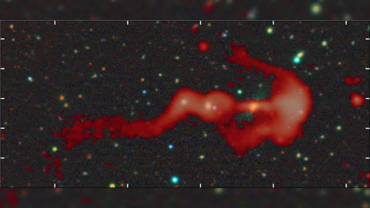 Strange glowing 'bow-and-arrow' structure may be a giant cosmic shock wave created by a supersonic galaxy collision