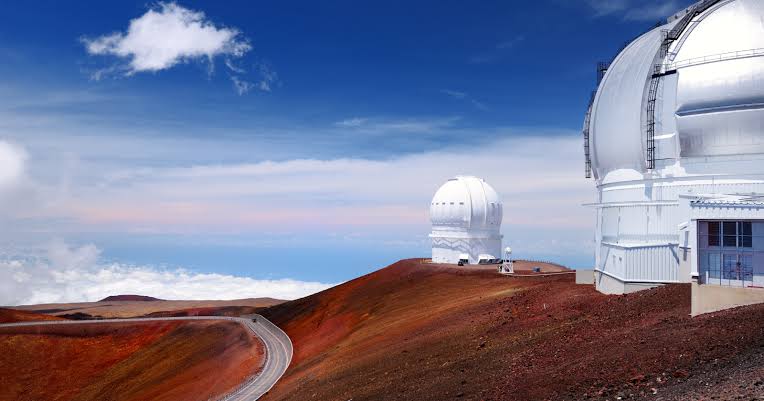 At the summit of Mauna Kea in Hawaii, the air is so thin and so dry that astronomers can see light from galaxies billions of light-years away with a clarity impossible at sea level — which is why 11 countries have built 13 major telescopes on what is technically a