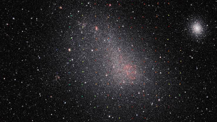 'I was really amazed': On the edge of the Milky Way, a dwarf galaxy is being ripped in half by its big sibling