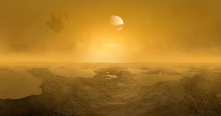 Saturn's moon Titan runs the same weather cycle as Earth — clouds, rain, rivers and seas — except the liquid doing all the work is methane, and the bedrock underfoot is water frozen at nearly minus 180 degrees, harder than most stone on Earth