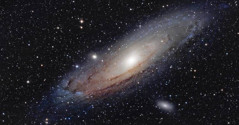 The light from the Andromeda Galaxy — the most distant object visible to the naked human eye — left its source about 2.5 million years ago, which means when you look at it on a clear night, you are seeing light that began its journey to Earth around the time th