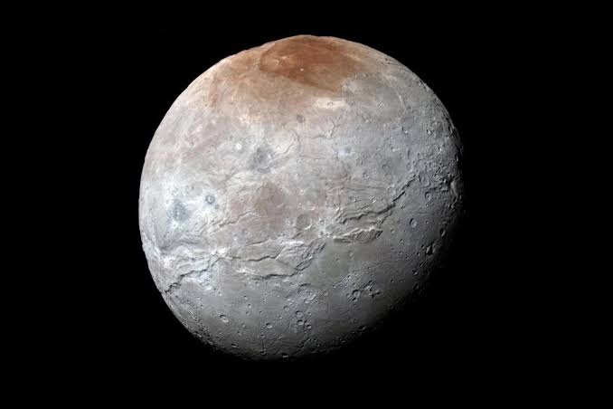 Weird Mountains on Pluto’s Largest Moon Charon Reveals a Surprising Past