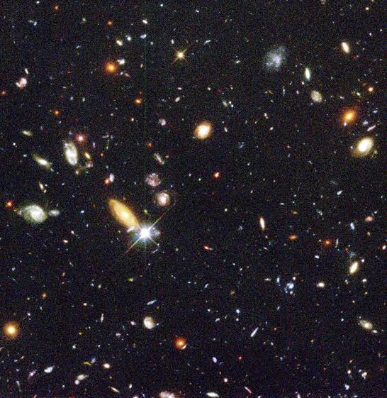 In 1995, astronomers pointed Hubble at a patch of sky so dark it looked empty and held it there for ten days. The image that came back contained roughly 3,000 galaxies — not stars, but galaxies — many holding billions of stars of their own.