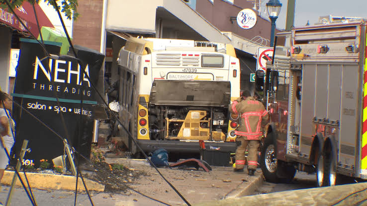 Second-alarm mass casualty declared after MTA bus crashes into FedEx Office building
