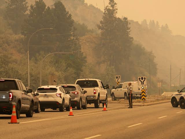 British Columbia wildfire forces more than 20,000 to flee, destroys homes
