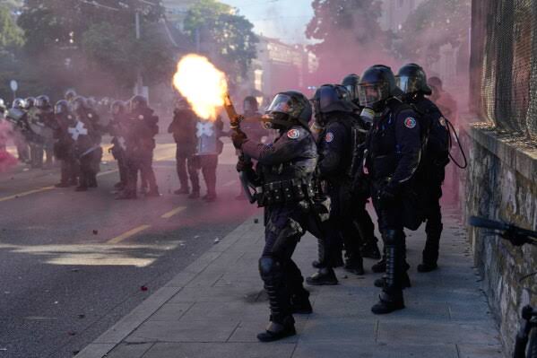 Protesters in Geneva clash with police ahead of the G7 summit in nearby France